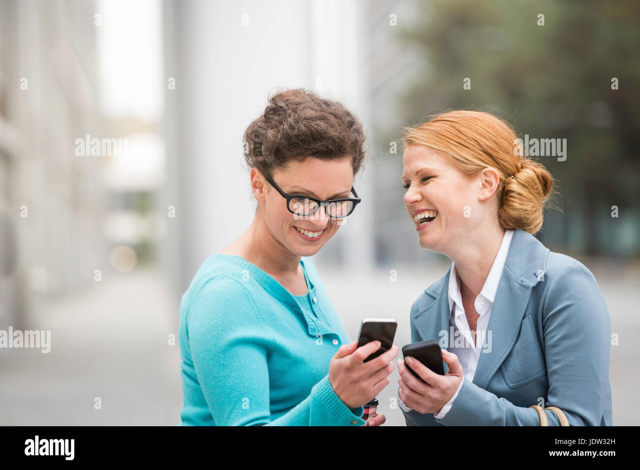 Business people using cell phones Stock Photo