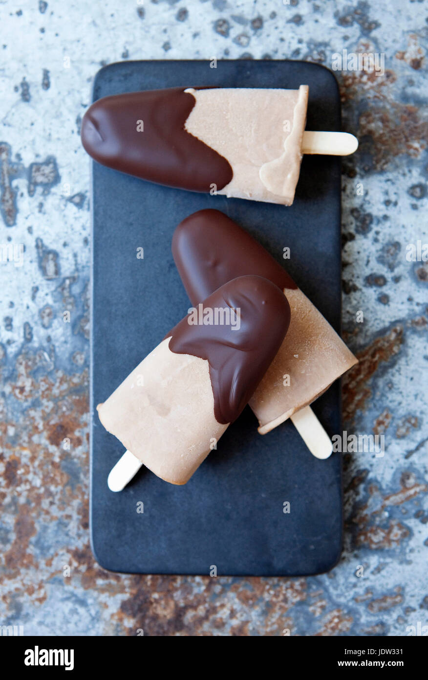 Ice cream bars dipped in chocolate Stock Photo