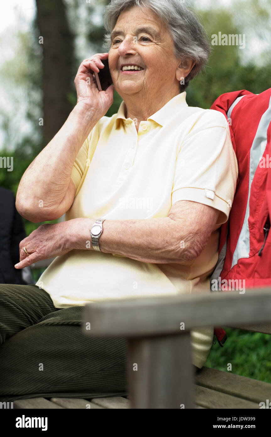 Older woman talking on cell phone Stock Photo
