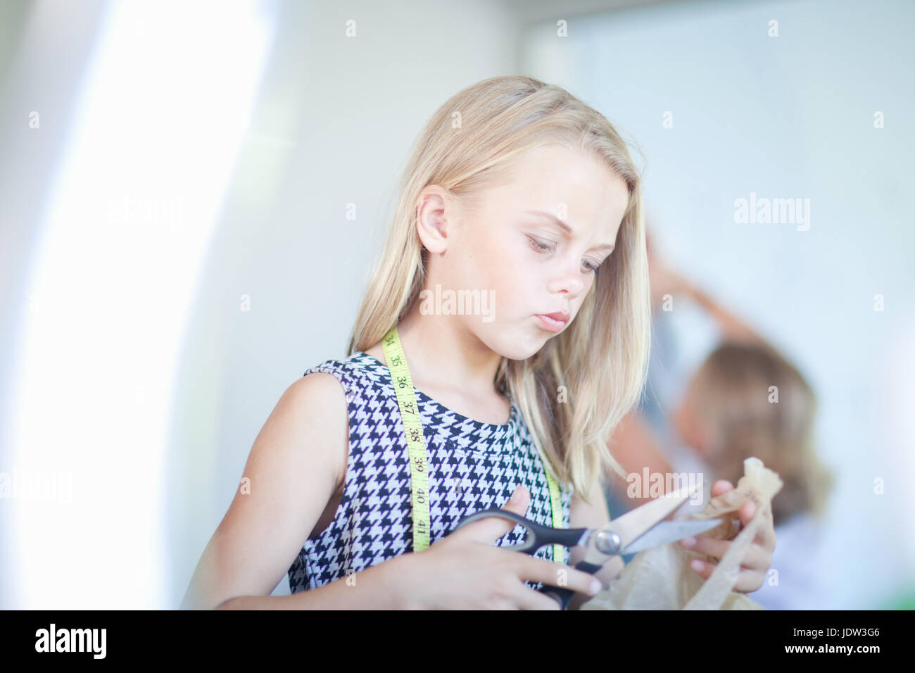 Girl playing fashion designer Stock Photo Alamy