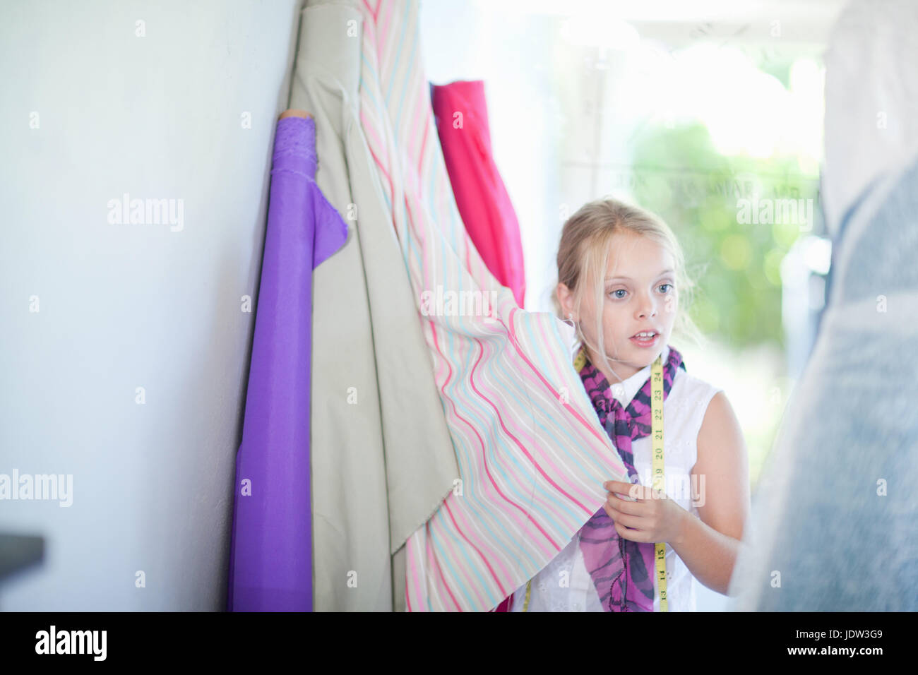 Girl playing fashion designer Stock Photo Alamy