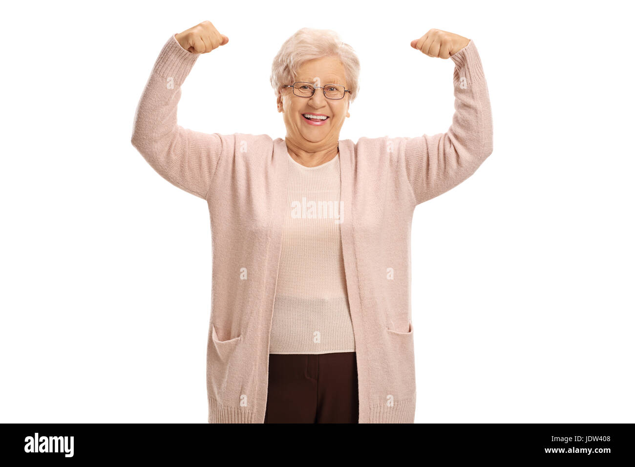 Cheerful mature woman flexing her muscles isolated on white background Stock Photo