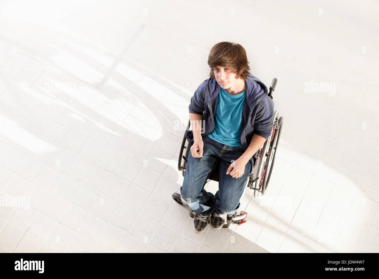 Teenage boy in wheelchair, high angle Stock Photo