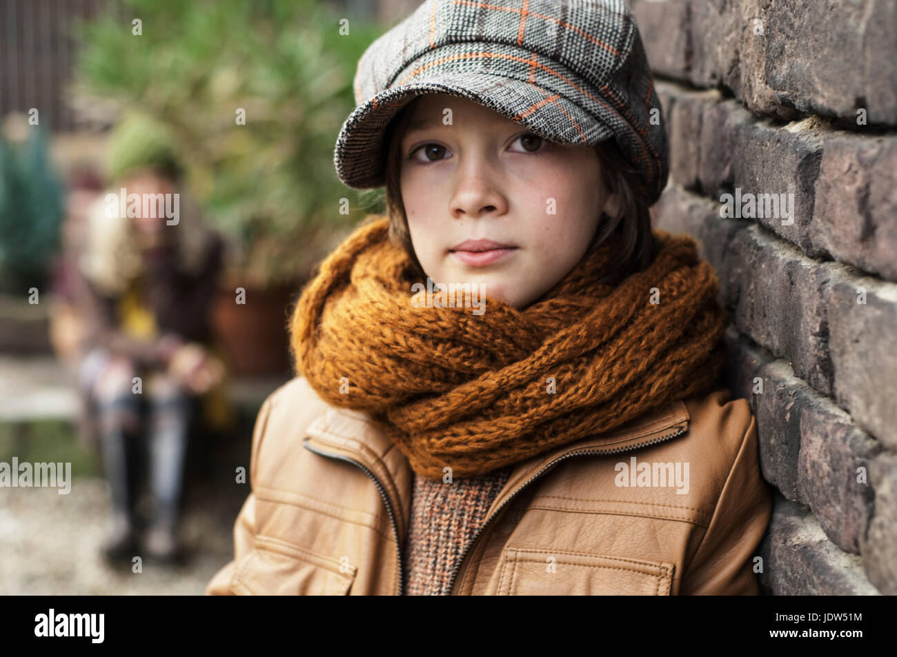 Boy wearing flat cap and scarf, portrait Stock Photo