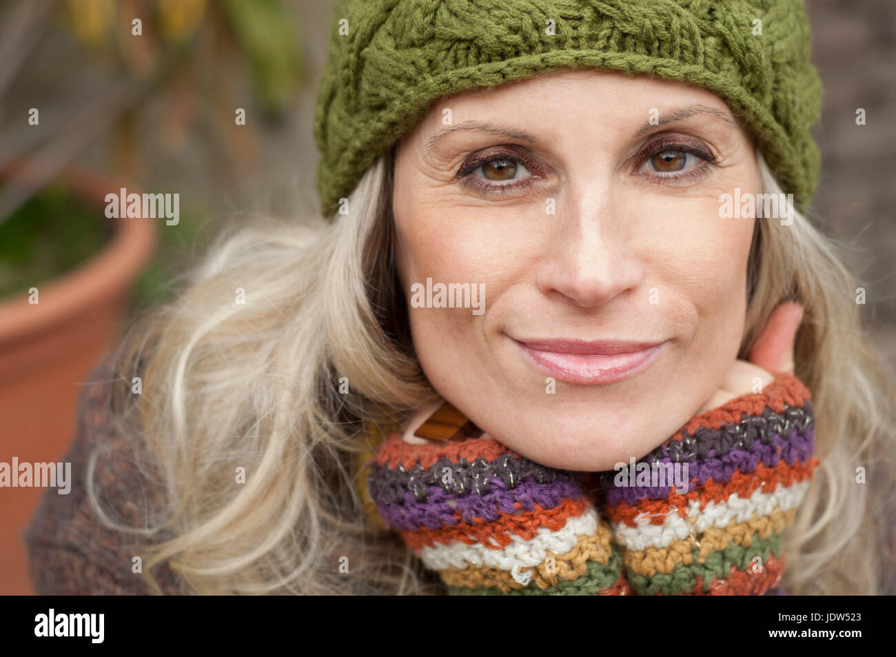 Mature woman in warm clothing and knit hat, portrait Stock Photo
