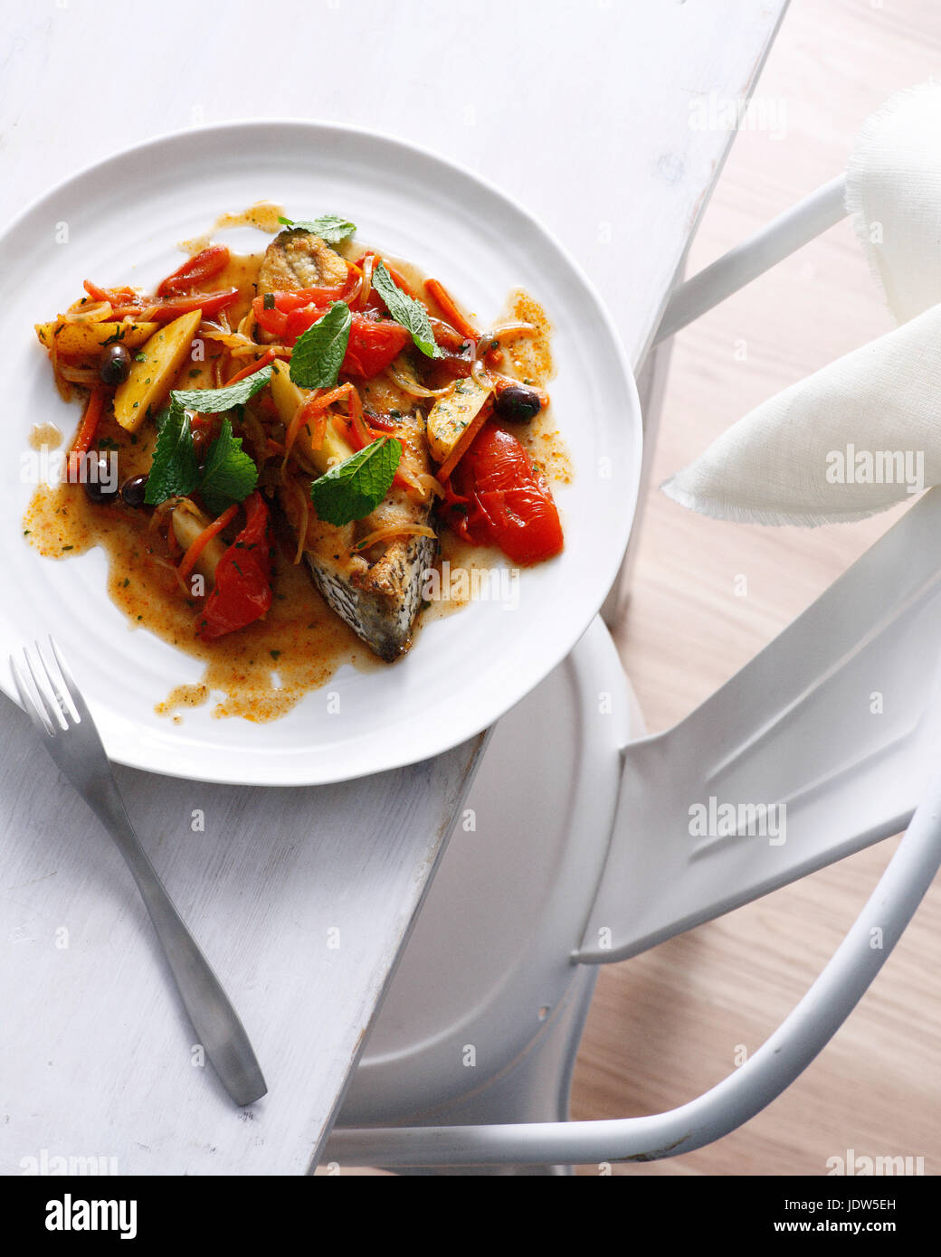 Fish tagine with vegetables and garnish Stock Photo