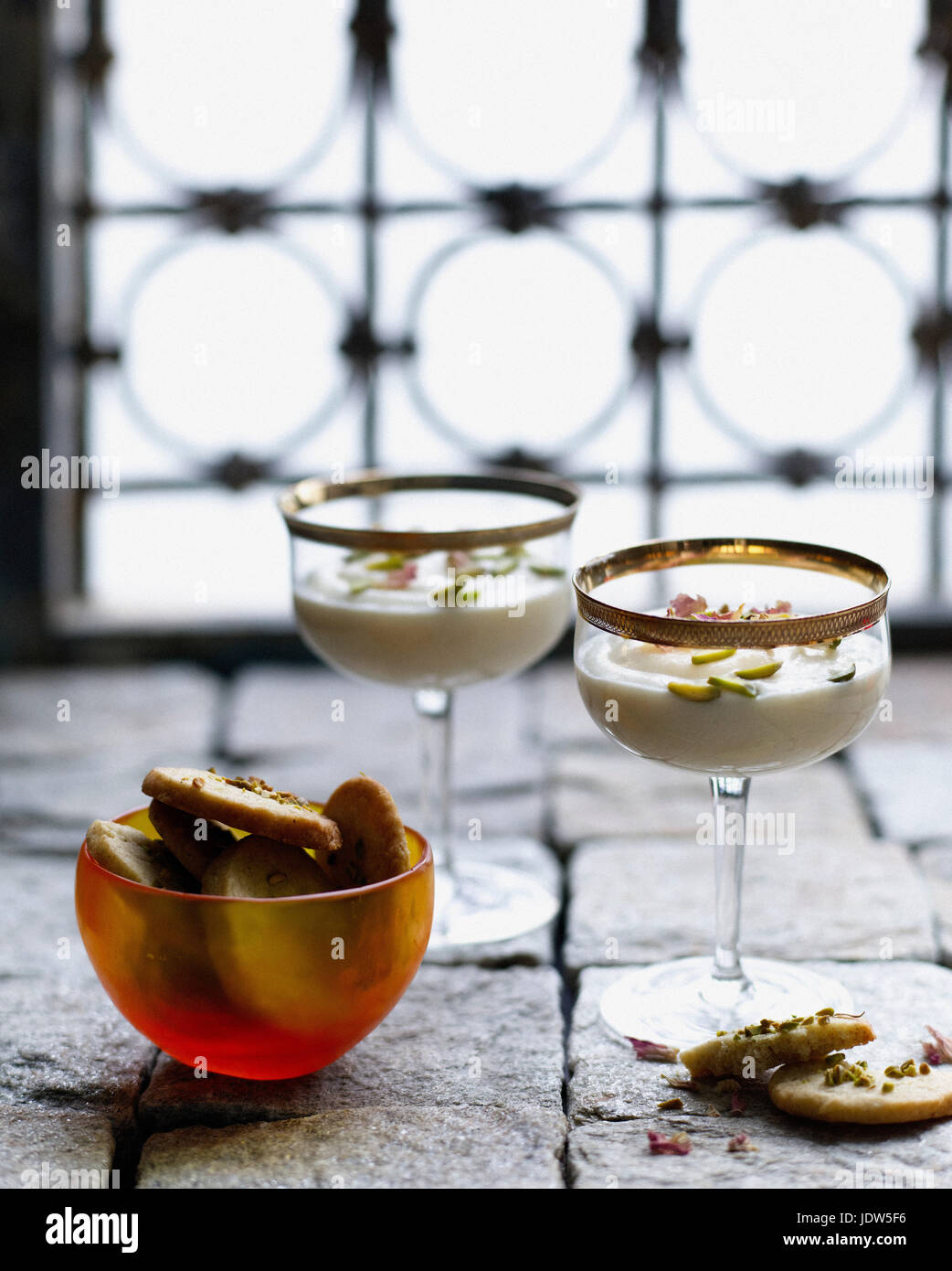 Ground rice dessert with pistachio shortbread Stock Photo