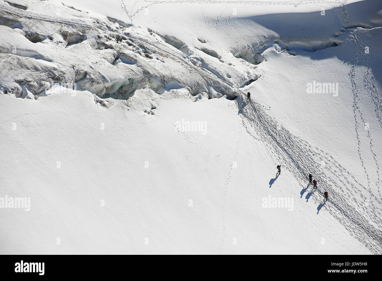 Mountaineers traversing deep snow, high angle Stock Photo