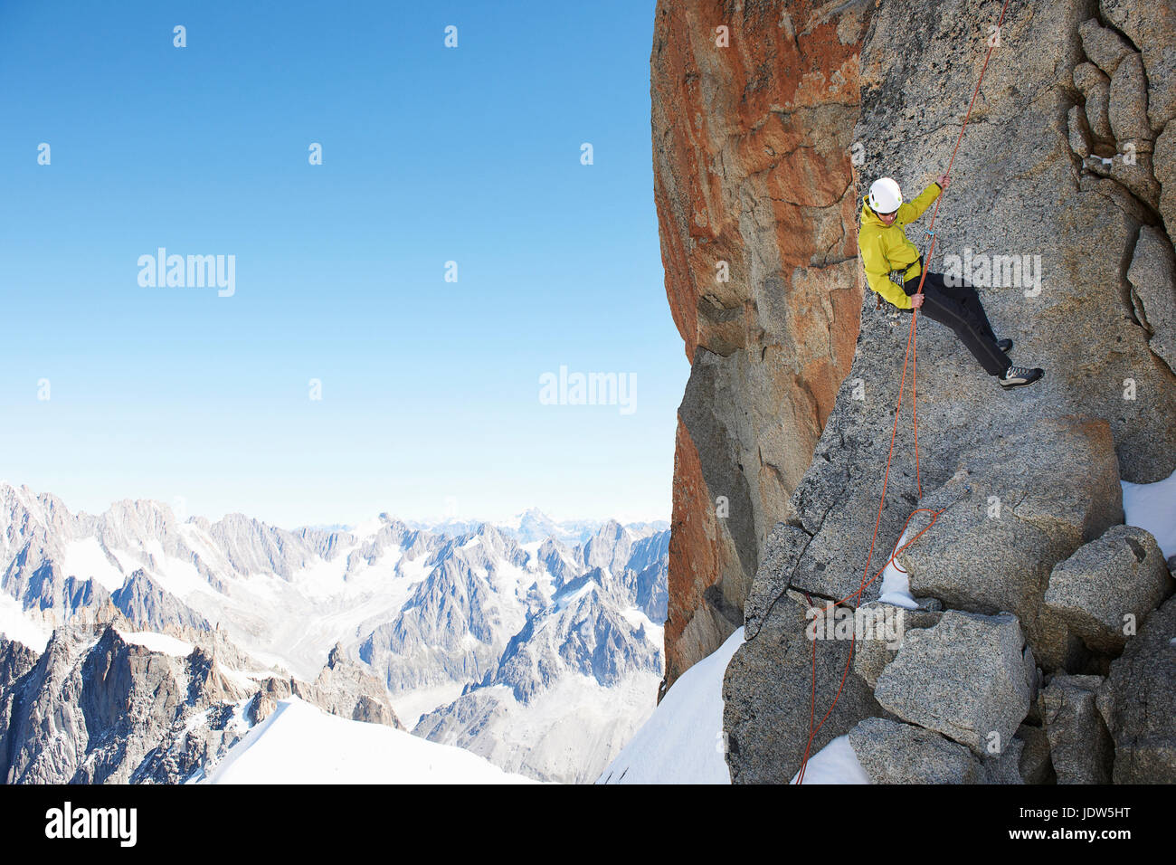 Mountaineer using climbing rope, Chamonix, Haute Savoie, France Stock Photo