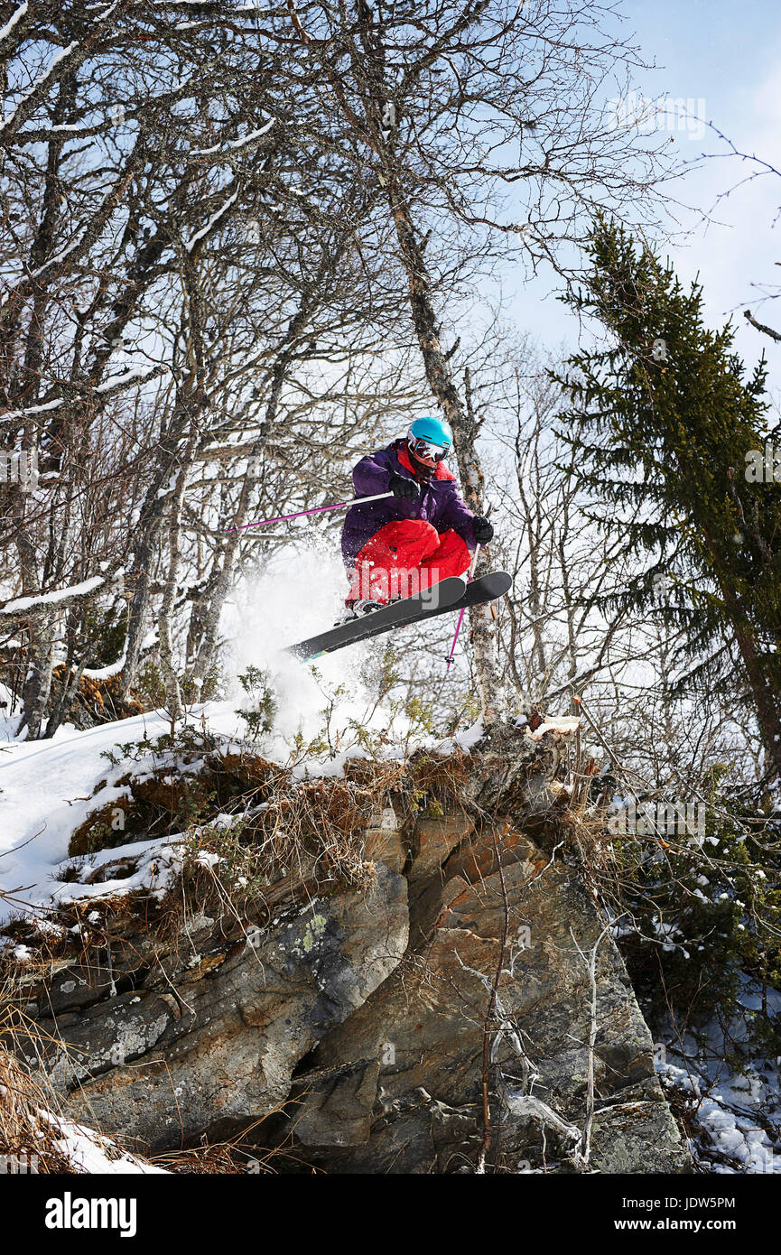 Skier jumping off rocks, Are, Sweden Stock Photo