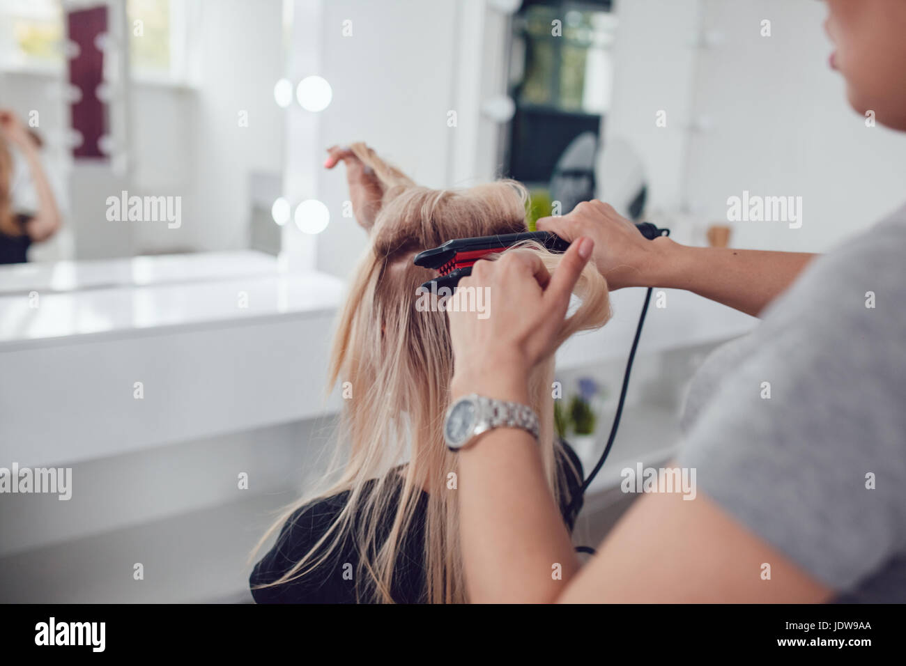 Haircare female using hair hi-res stock photography and images - Alamy