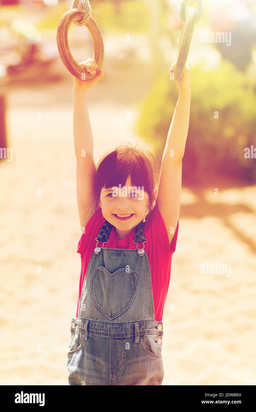 happy little girl on children playground Stock Photo - Alamy