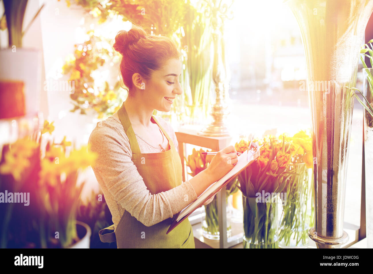 florist woman with clipboard at flower shop Stock Photo - Alamy