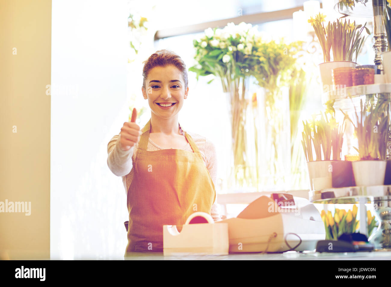 florist woman at flower shop showing thumbs up Stock Photo - Alamy