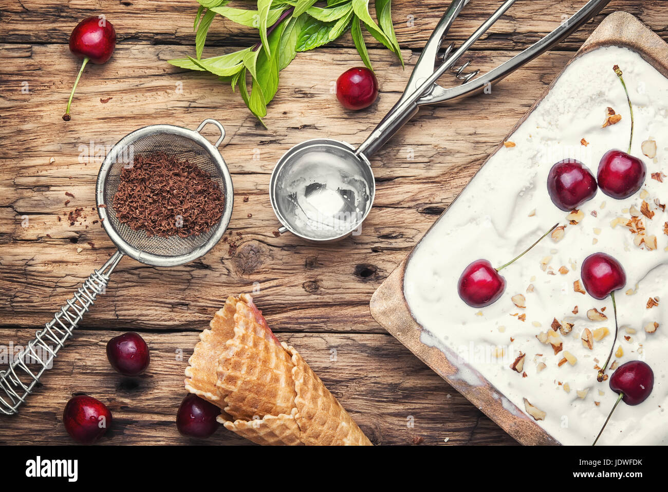 vanilla ice cream in waffle cones and cherry berries Stock Photo