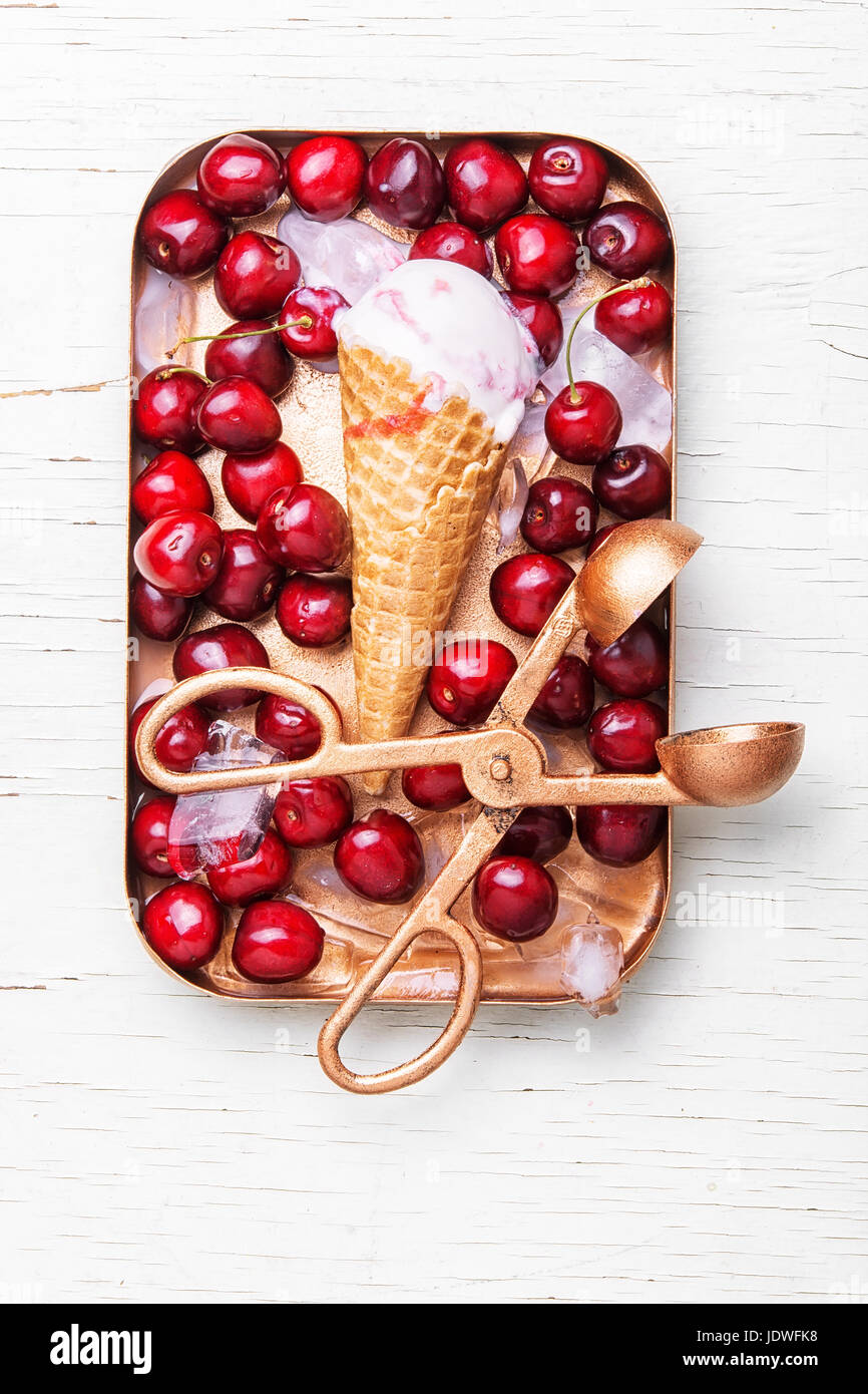 ice cream in waffle cones and cherry on white background Stock Photo