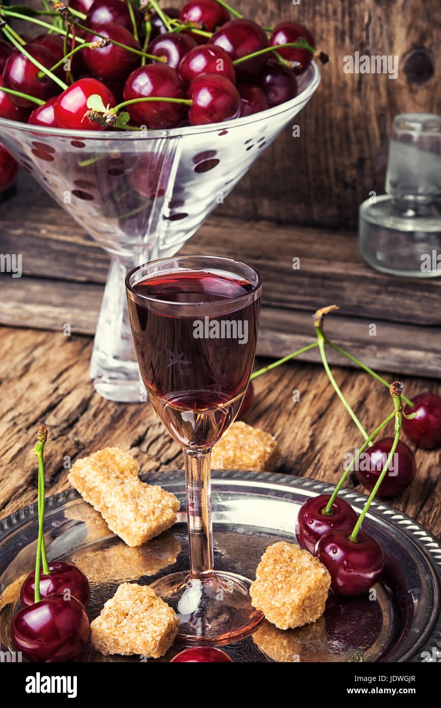 Homemade alcohol tincture from summer cherry berries Stock Photo Alamy