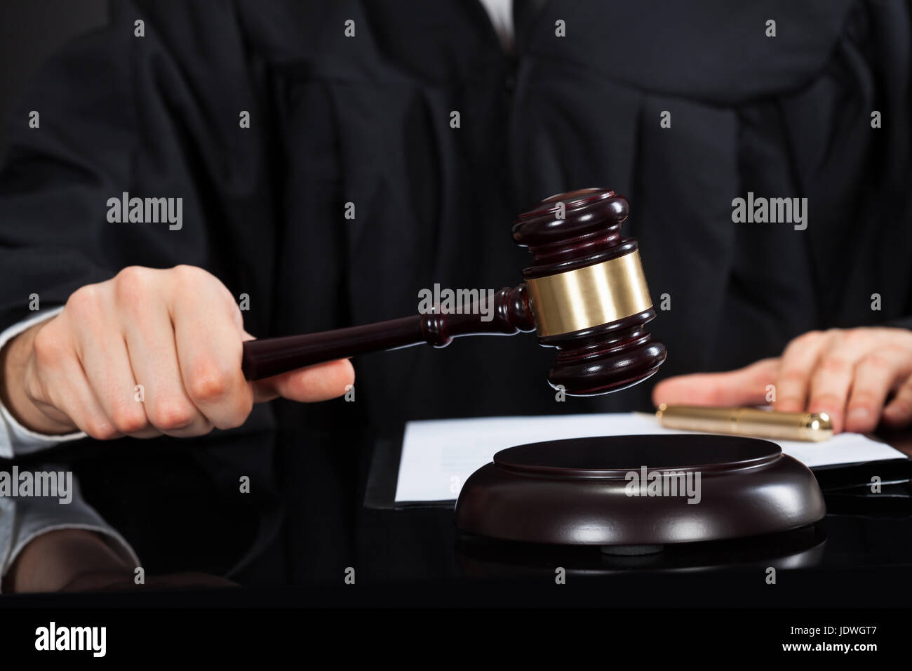 Closeup of male judge with mallet at desk Stock Photo Alamy