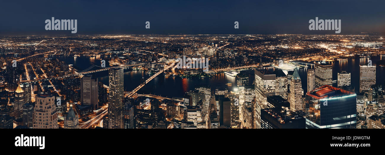 Rooftop night panorama view of New York City downtown with urban ...
