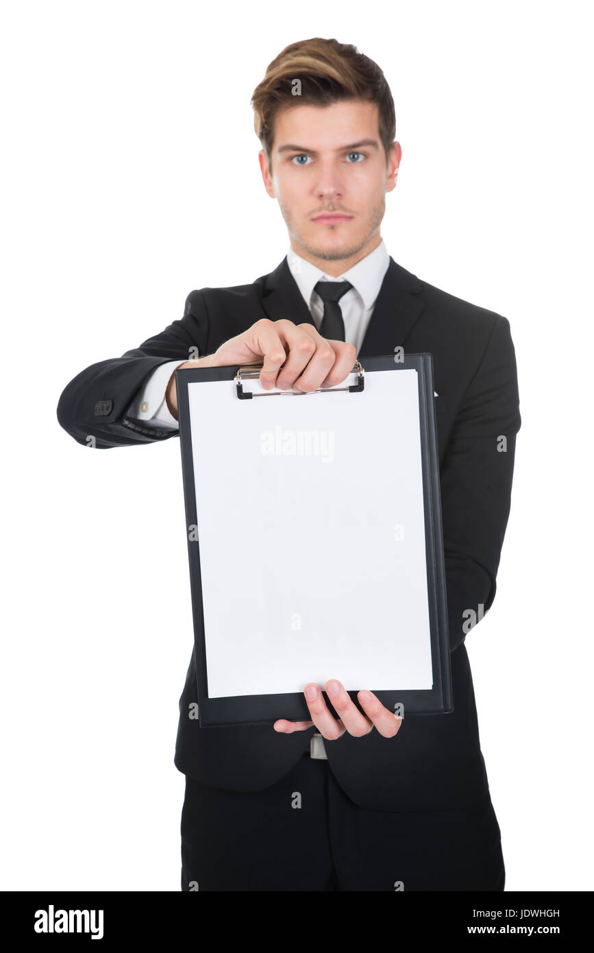 Portrait of confident businessman holding clipboard with blank paper ...