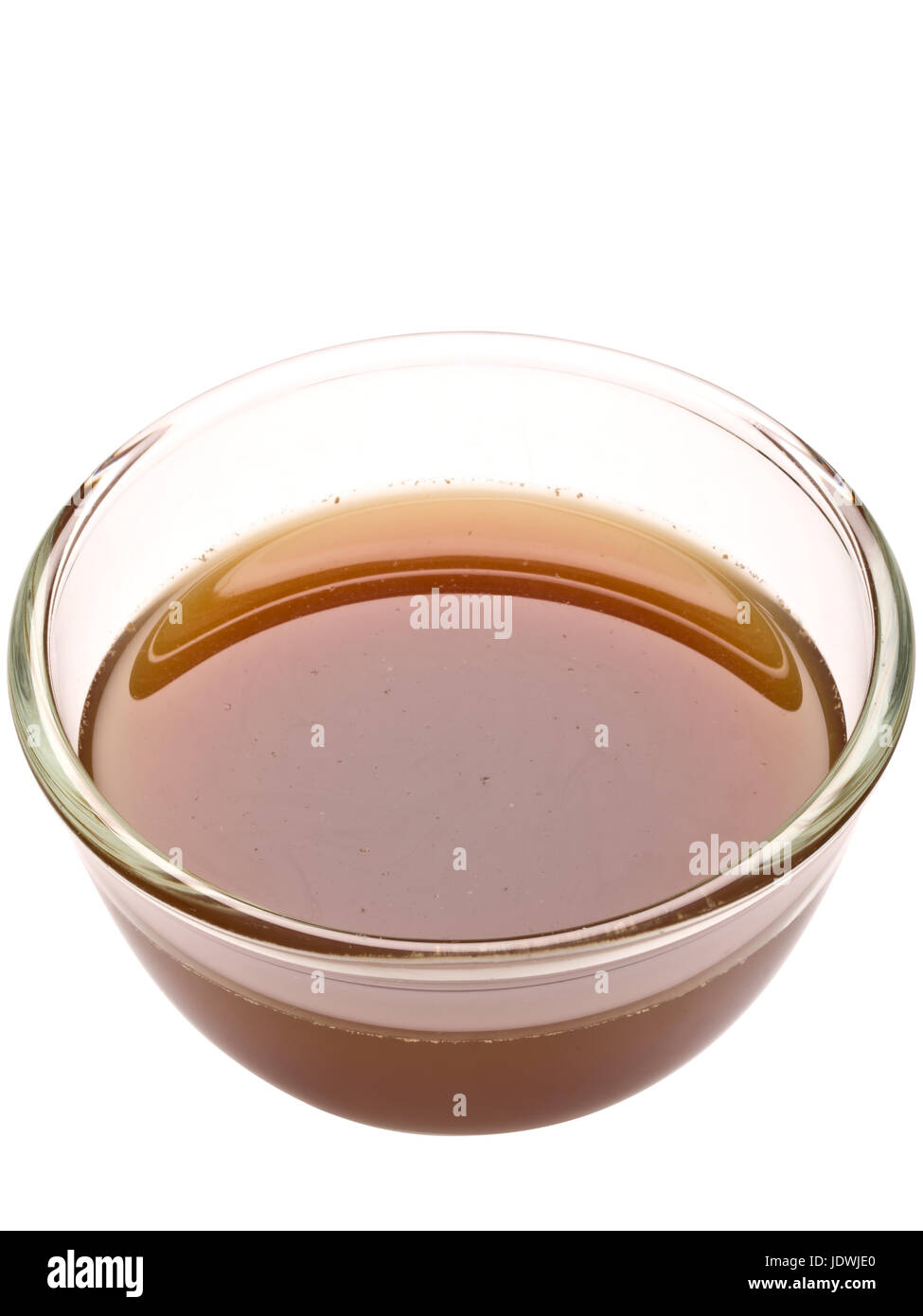 close up of a bowl of beef stock isolated Stock Photo