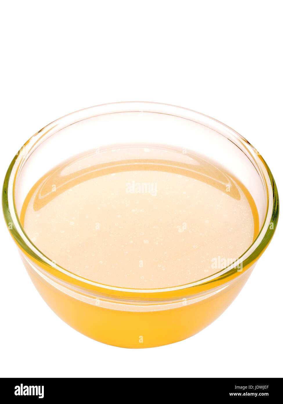 close up of a bowl of chicken stock isolated Stock Photo