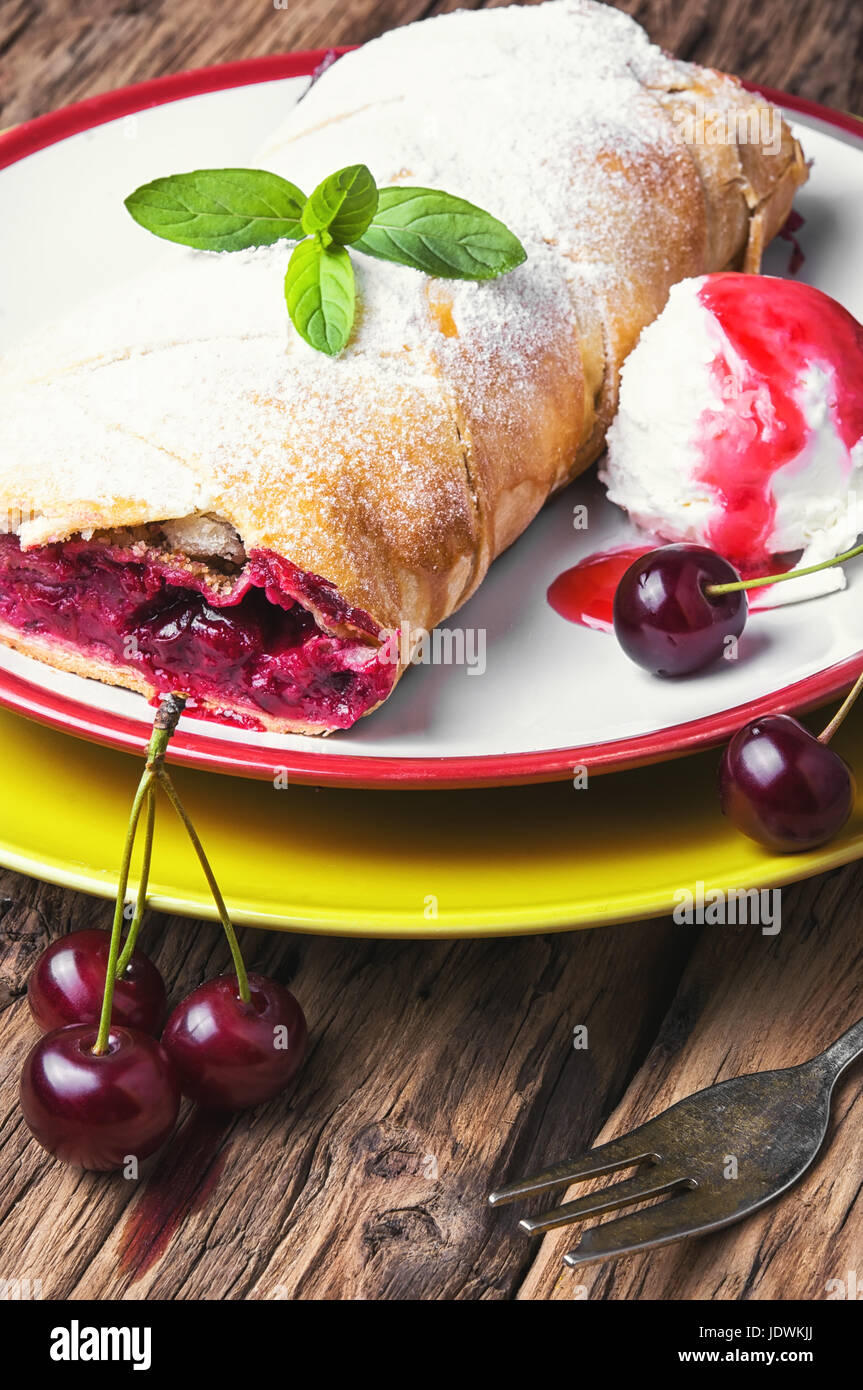 Traditional puff pastry strudel with berries of cherry Stock Photo