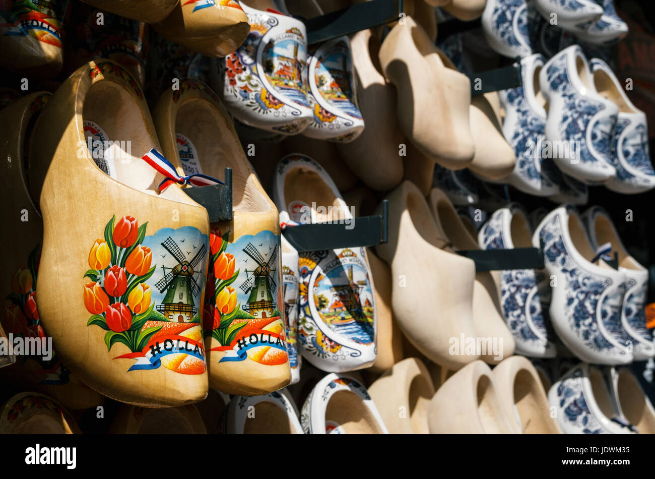 Volendam, Netherlands - 26 April, 2017: klomp or klompen - dutch clogs made of poplar wood, traditional shoes with colorful paintings. Popular Netherl Stock Photo
