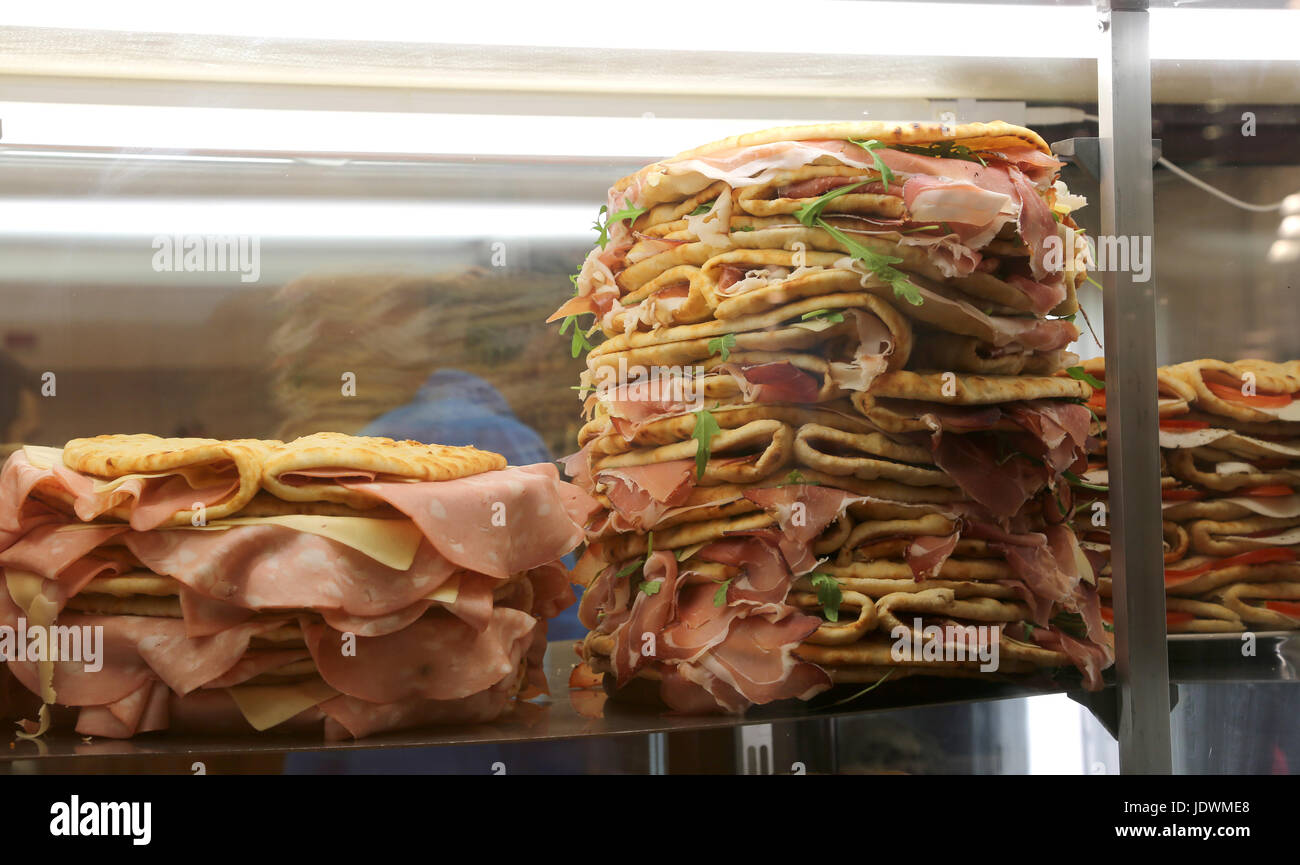 Refrigerator with lots of stuffed sandwiches called Spianata or Piadina