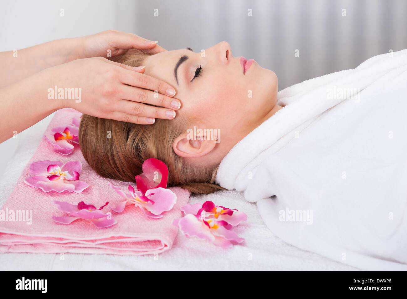 Young Woman With Eyes Closed Getting Head Massage From Masseuse Stock ...