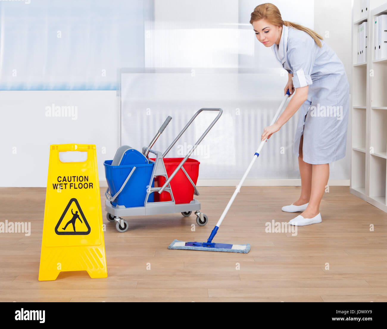 Portrait Of Young Maid Cleaning Floor With Mop Stock Photo Alamy