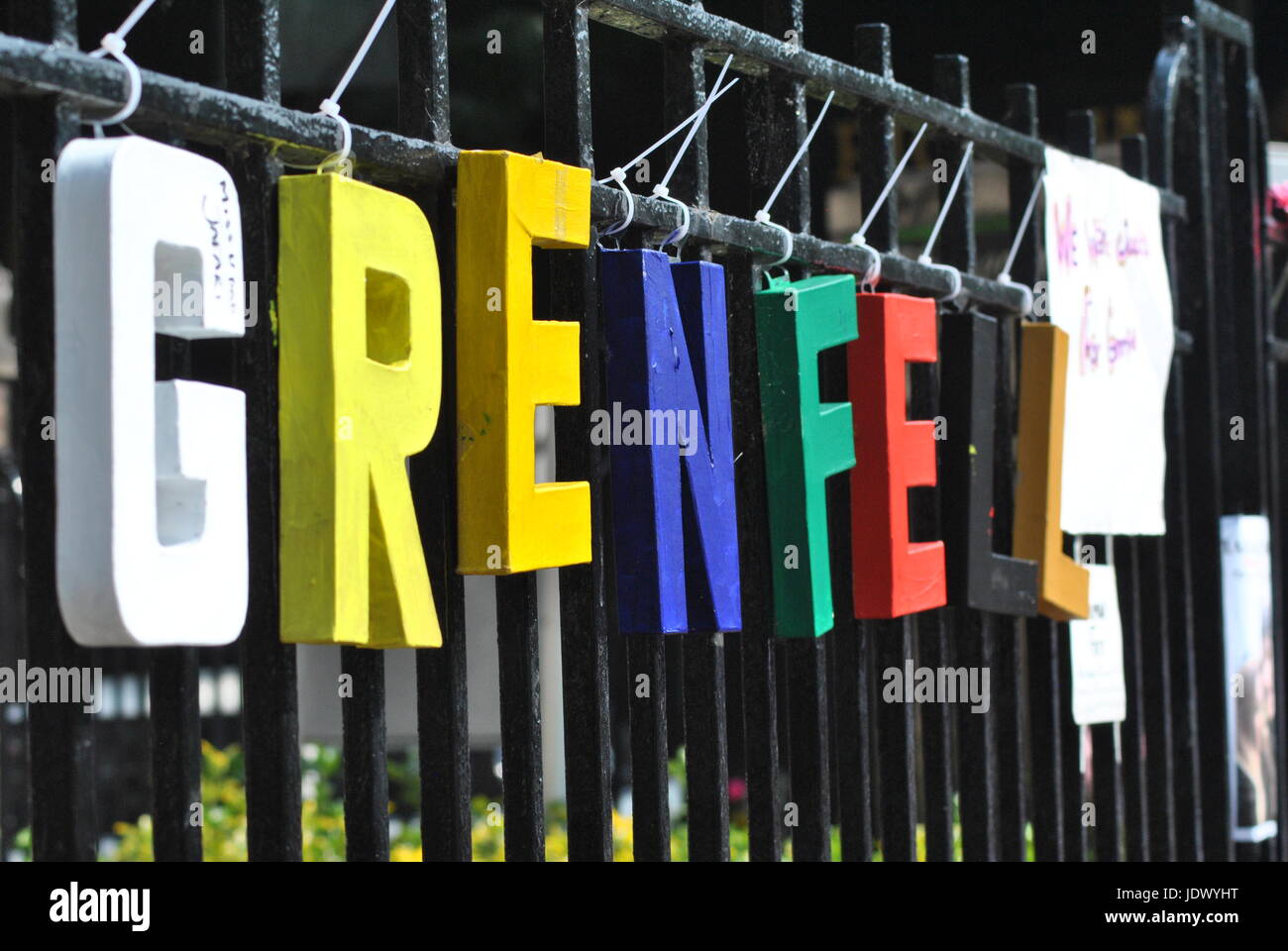 Grenfell  in Memorial Letters on Fence (at the boundary of where the building stands) The People Remember Stock Photo