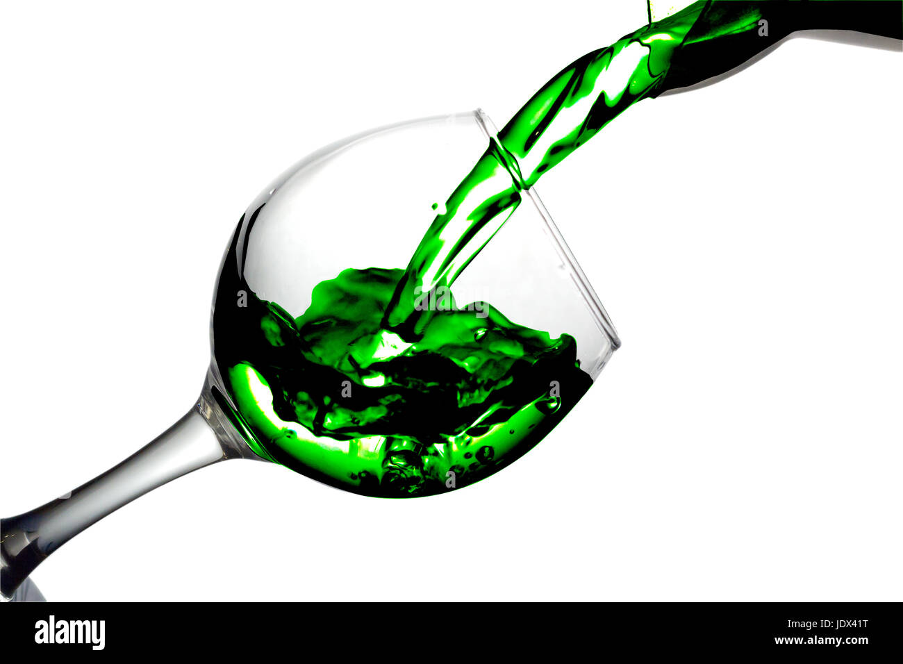 Green liquid, water, blackberry juice pours into a glass, liquid in a speaker, isolated on a white background Stock Photo