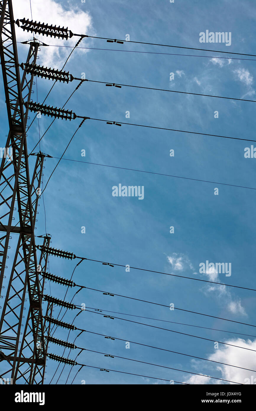 Electric high voltage post with sky background, Spain Stock Photo