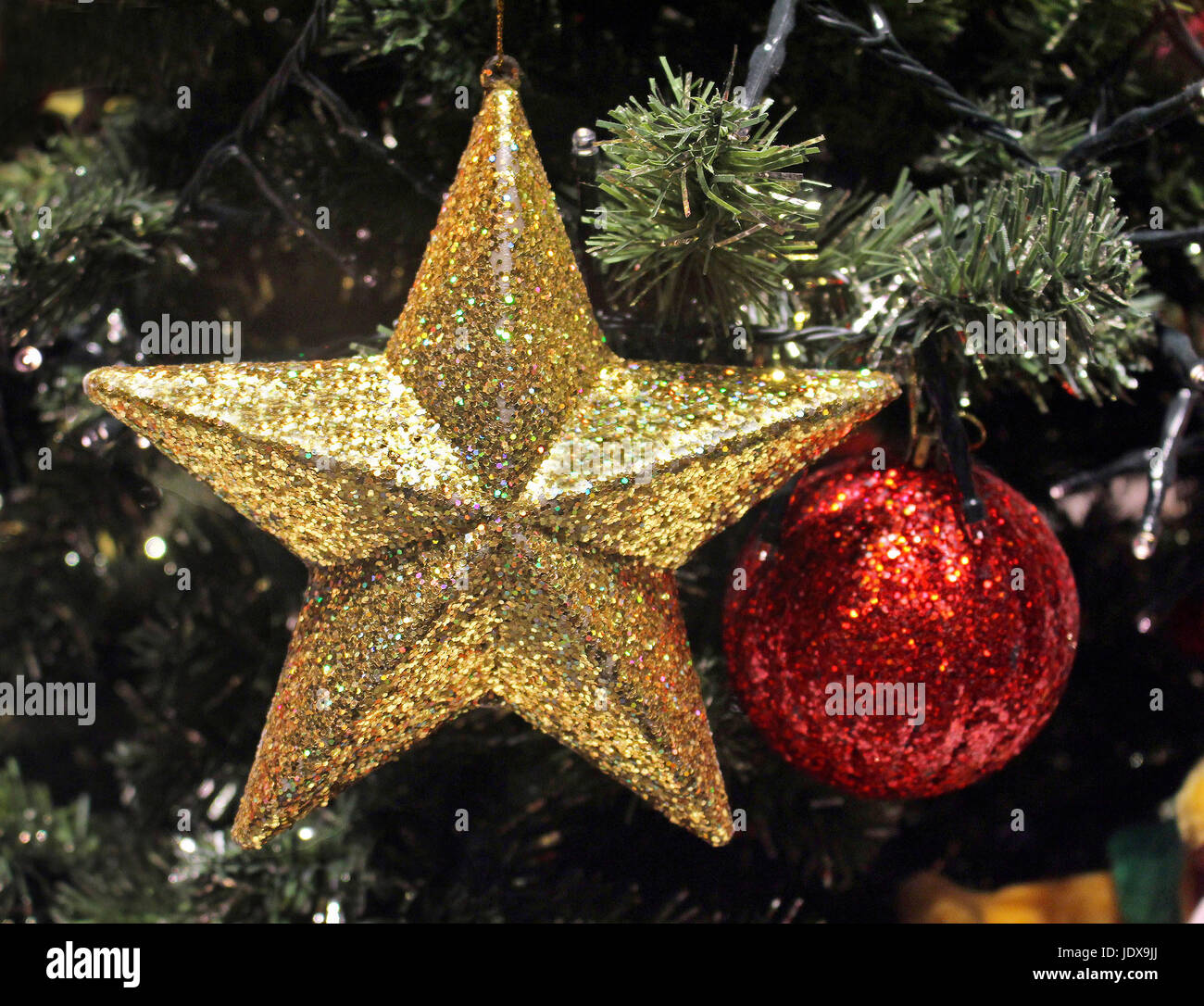 Shiny sparkling gold star on Christmas tree Stock Photo Alamy