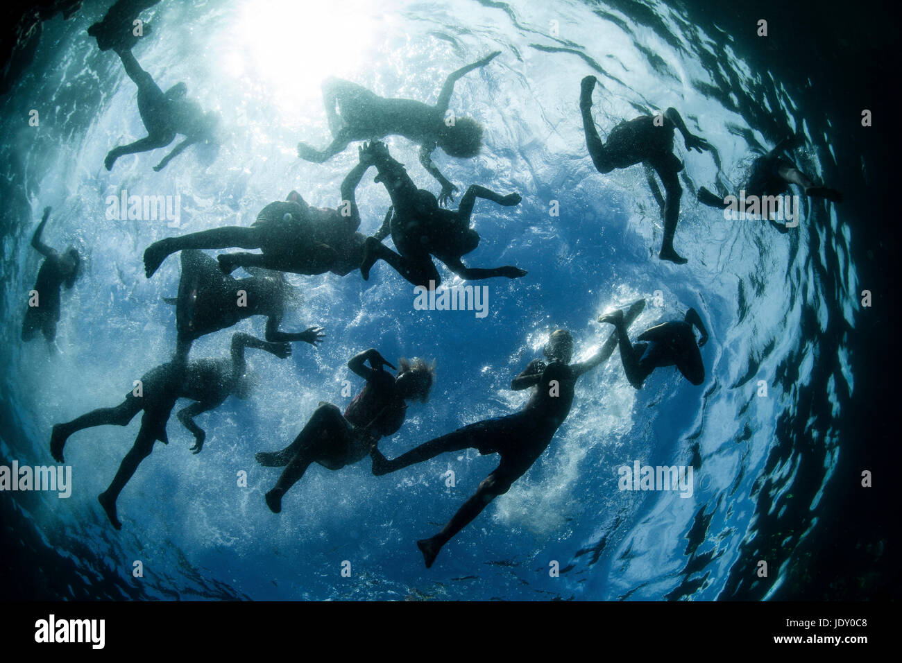 Kids splashing in Ocean, Melanesia, Pacific Ocean, Solomon Islands Stock Photo