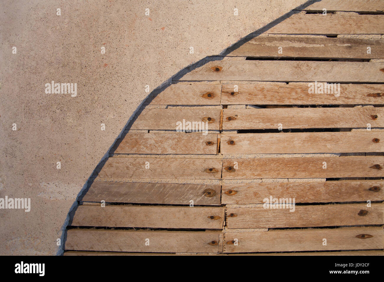 Abstract wood lattice wall and plaster. Gritty textured damaged background. Stock Photo