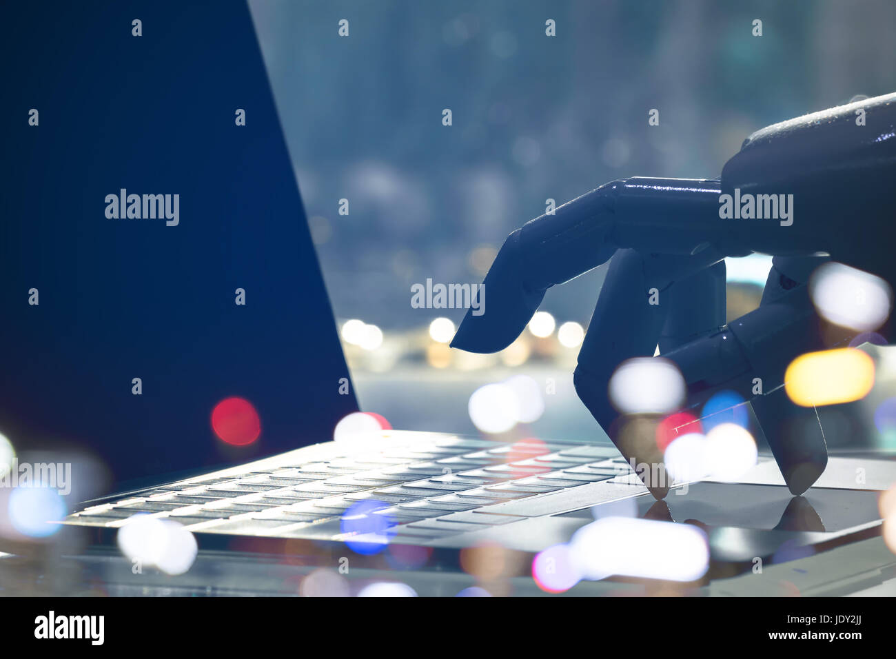 Artificial intelligence , chatbot , cyber communication , robot world and robo advisor. Robot finger point to laptop button with bokeh background. Stock Photo