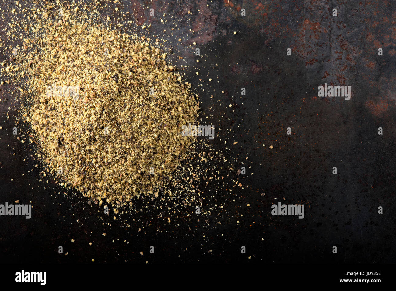 Rusty Peper Black pepper powder on a dark rusty background with copy space Stock ...