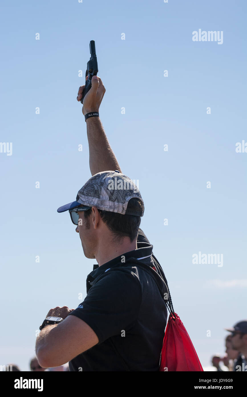 Pescara, Italy June 18, 2017 Man shoots with the starting pistol for