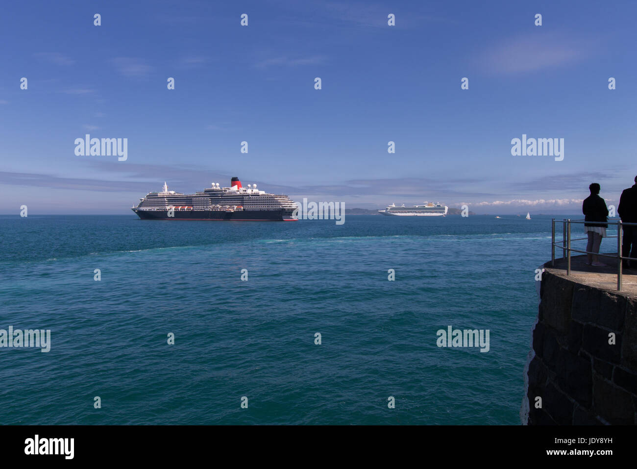 Cruise Ships Lie at Anchor Outside the Harbour at Saint Peter port, Guernsey, Stock Photo
