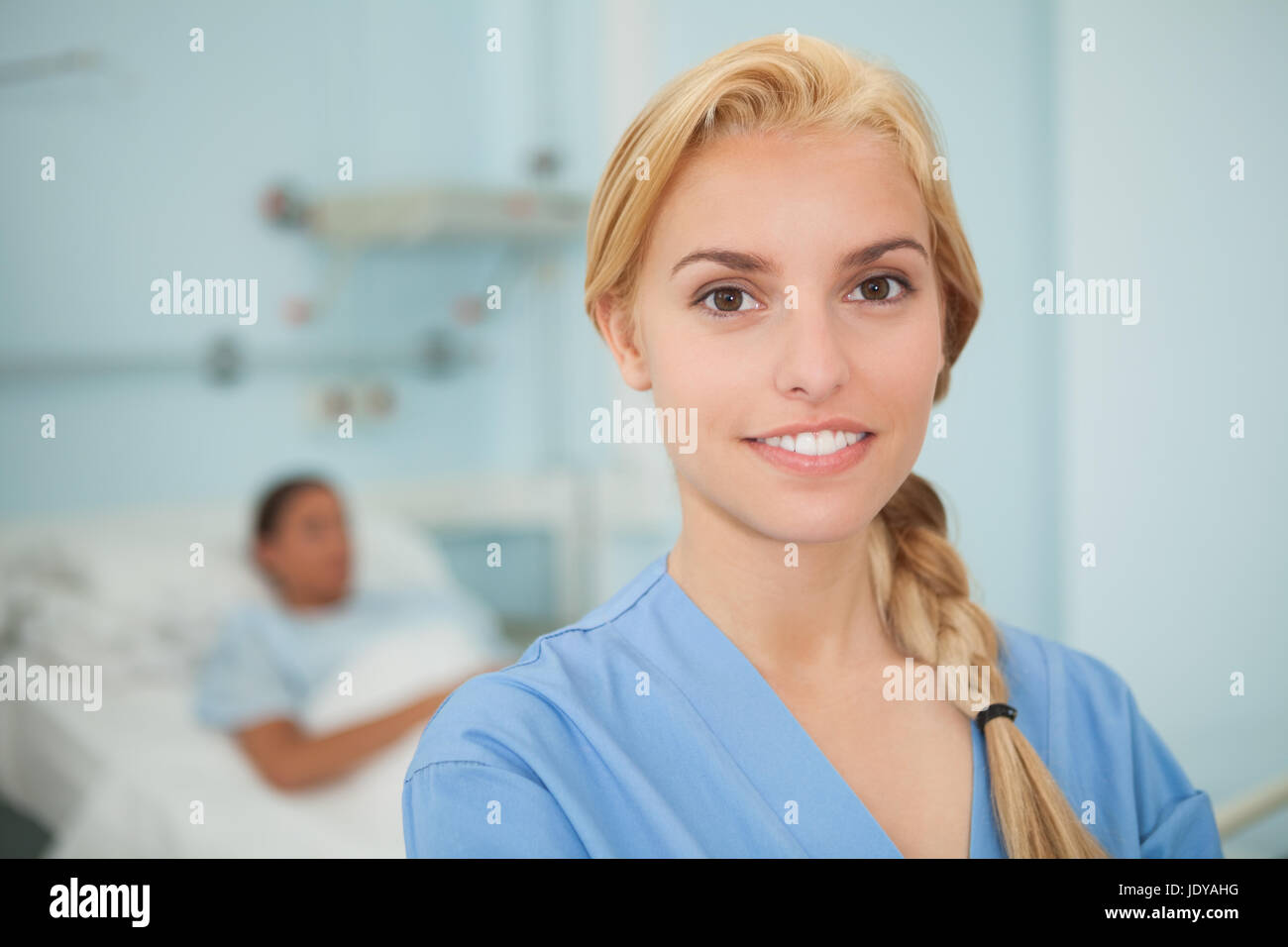 Blonde nurse smiling standing up hi-res stock photography and images ...