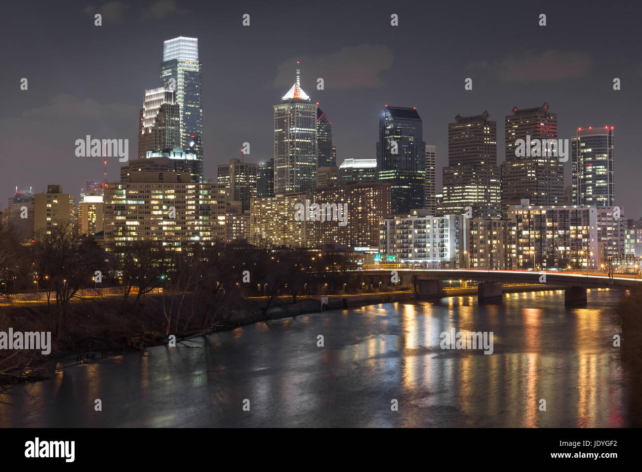 Skyline of center city Philadelphia at night with Schuylkill River in foreground Stock Photo