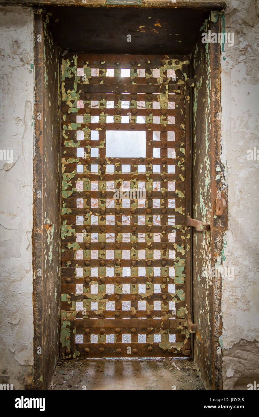 Prison cell door in Eastern State Penitentiary,  also known as ESP, is a former American prison in Philadelphia, Pennsylvania. Stock Photo