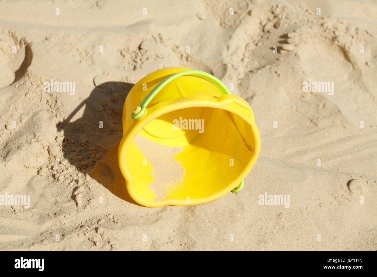 Plastic Toys in a Sandpit on a Playground for children Stock Photo