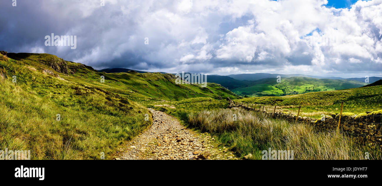 Panoramic view looking down into the Kentmere valley from just below the high point of the Garburn Road Stock Photo