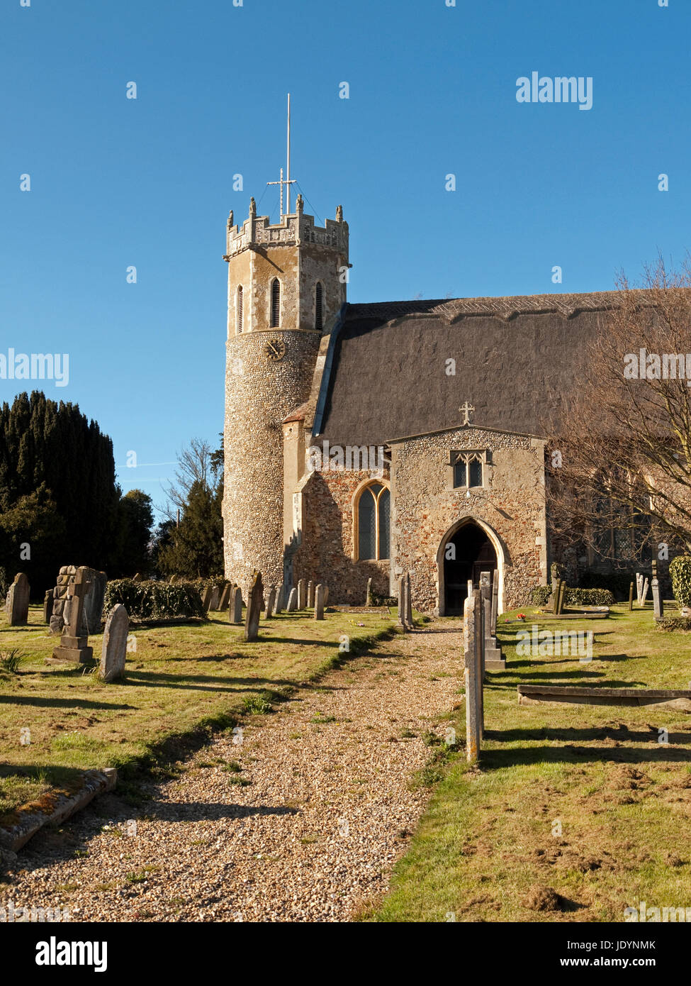 The Thatched Church of St Edmund with its Saxon Round Tower in Acle, Norfolk, England, UK Stock Photo