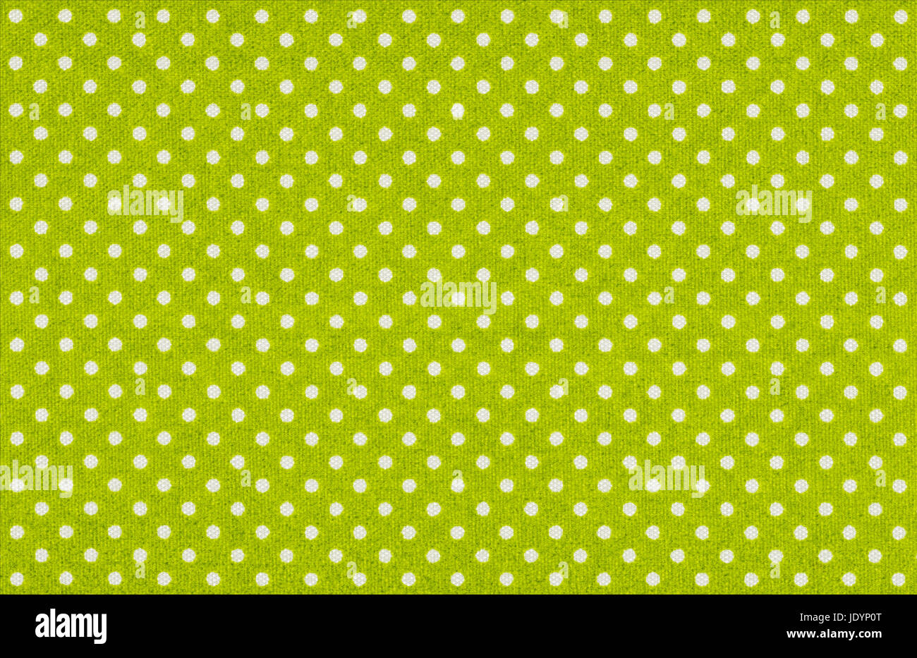 Hellgrüner Stoff mit weißen Punkten Stock Photo