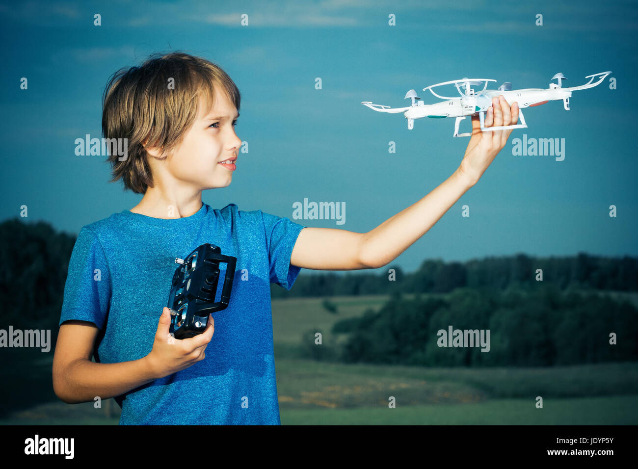 Little boy playing with drone in summer day outdoors Stock Photo - Alamy