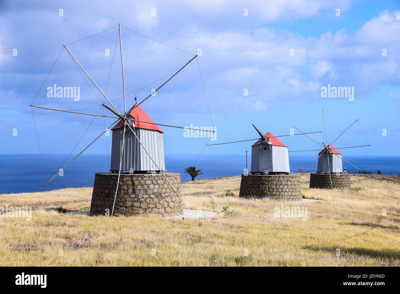 Traditional windmills that once produced flour for ships on the way to America found on the hillside in Porto Santo Island, Maderia, Portugal Stock Photo